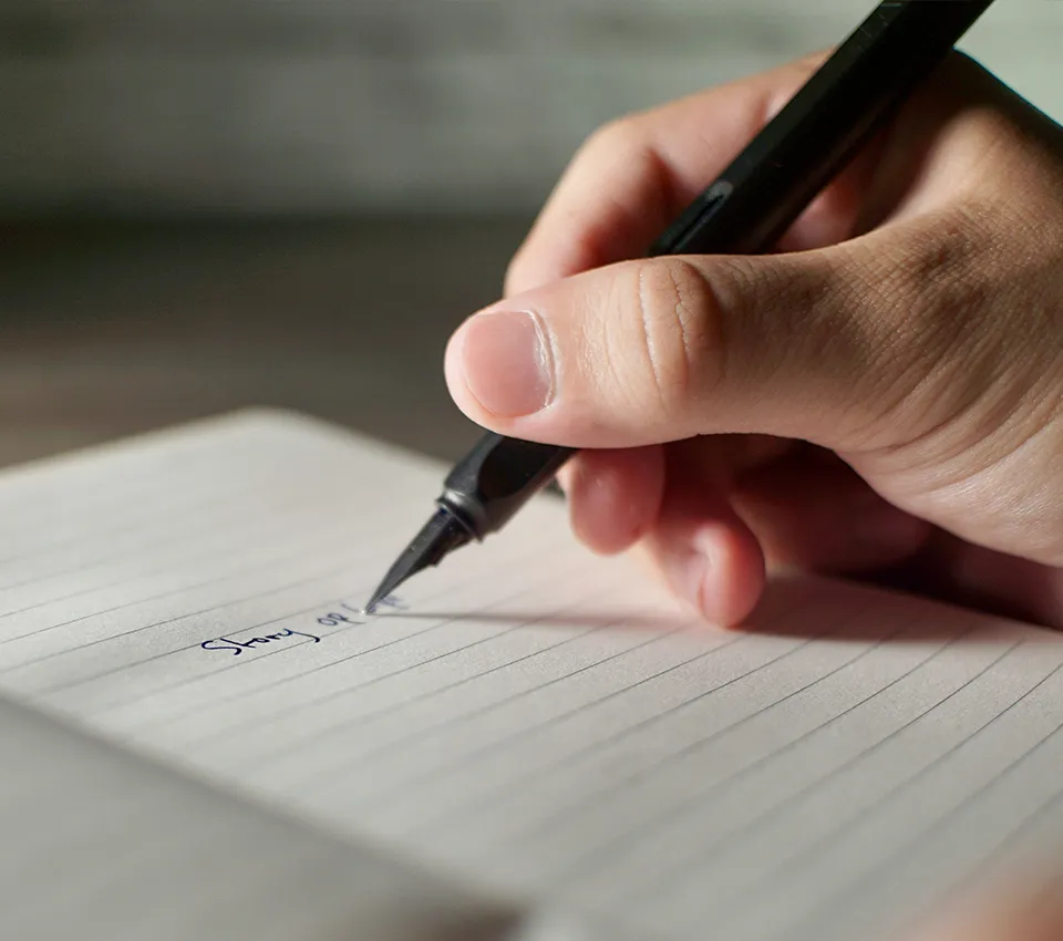 hand writing with a fountain pen